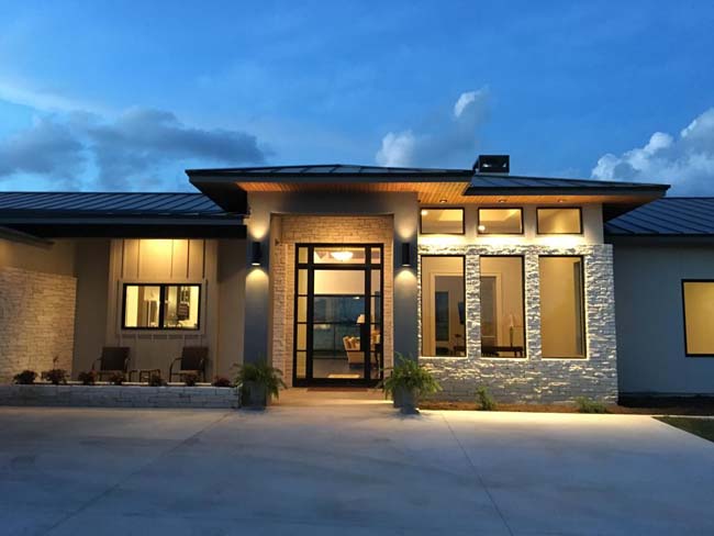Show home front elevation design Comanche Trace - Riverside Home Designs Custom Home Portfolio